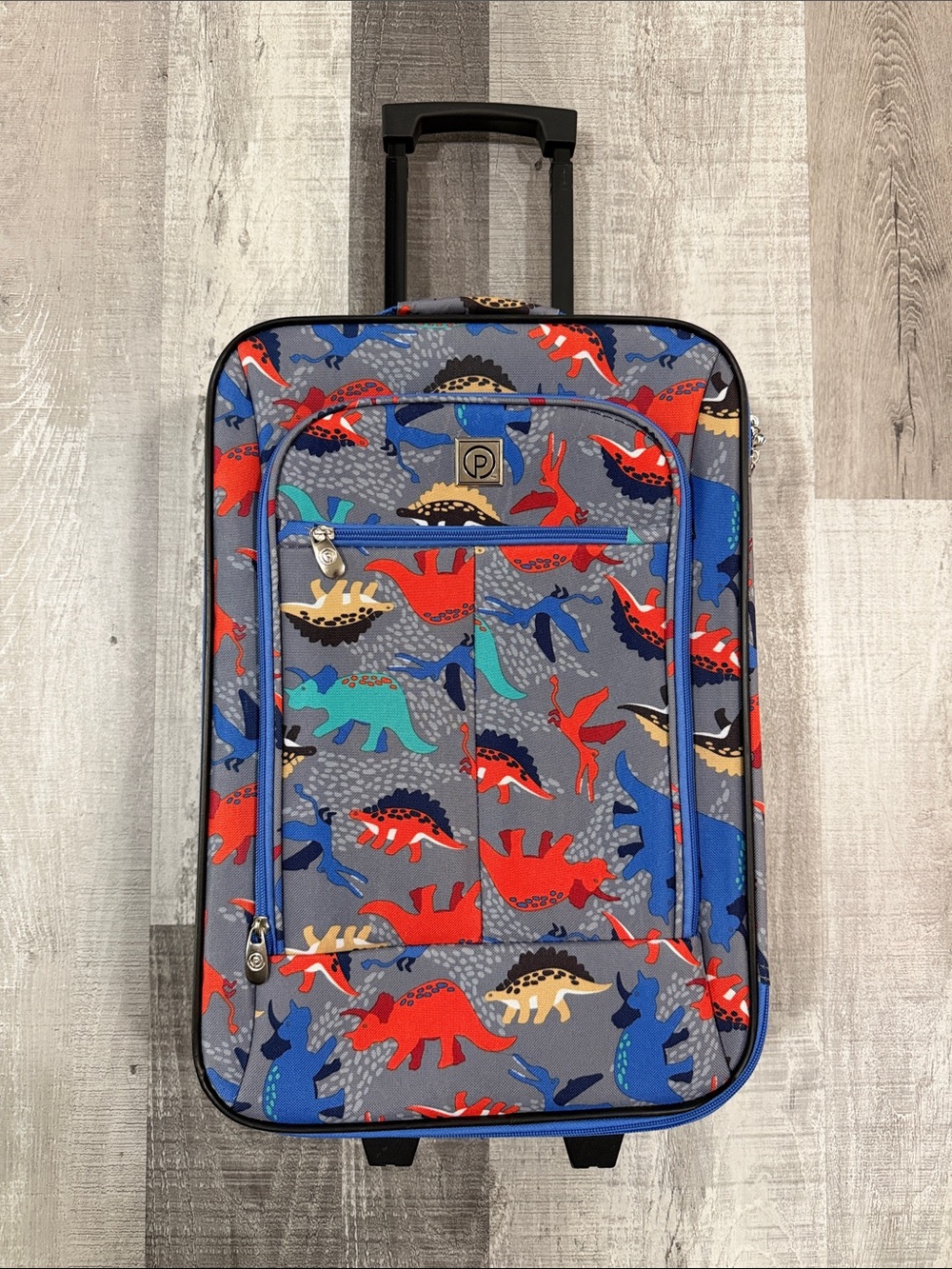 Amazon Kids Rolling Luggage with Red, Blue, Teal & Tan Dinosaur Print